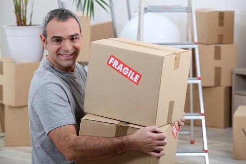 Urgent same day removals team loading furniture in Uxbridge