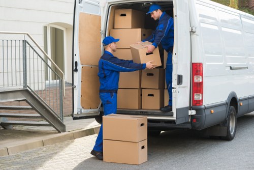 Loading boxes and furniture into a moving van