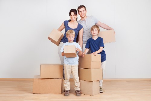 Packed moving boxes and a removals van for a Uxbridge relocation