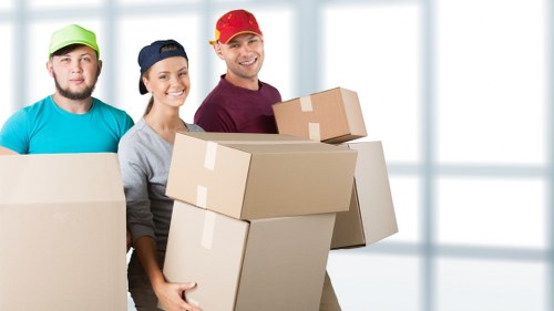 Team collecting bulky furniture items for disposal in Uxbridge