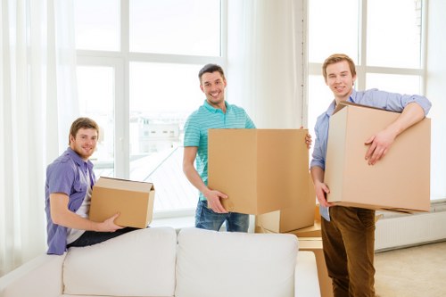 Careful loading of sofas, tables, and wardrobes for transport