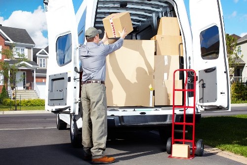 Team moving furniture safely through a property entrance