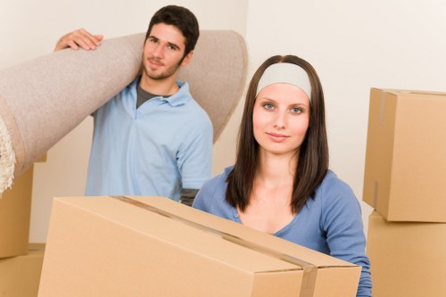 Professional movers packing household items securely