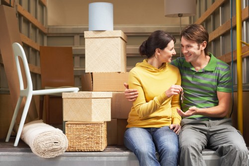 Experienced removalists in Uxbridge transporting boxes and furniture to a new home